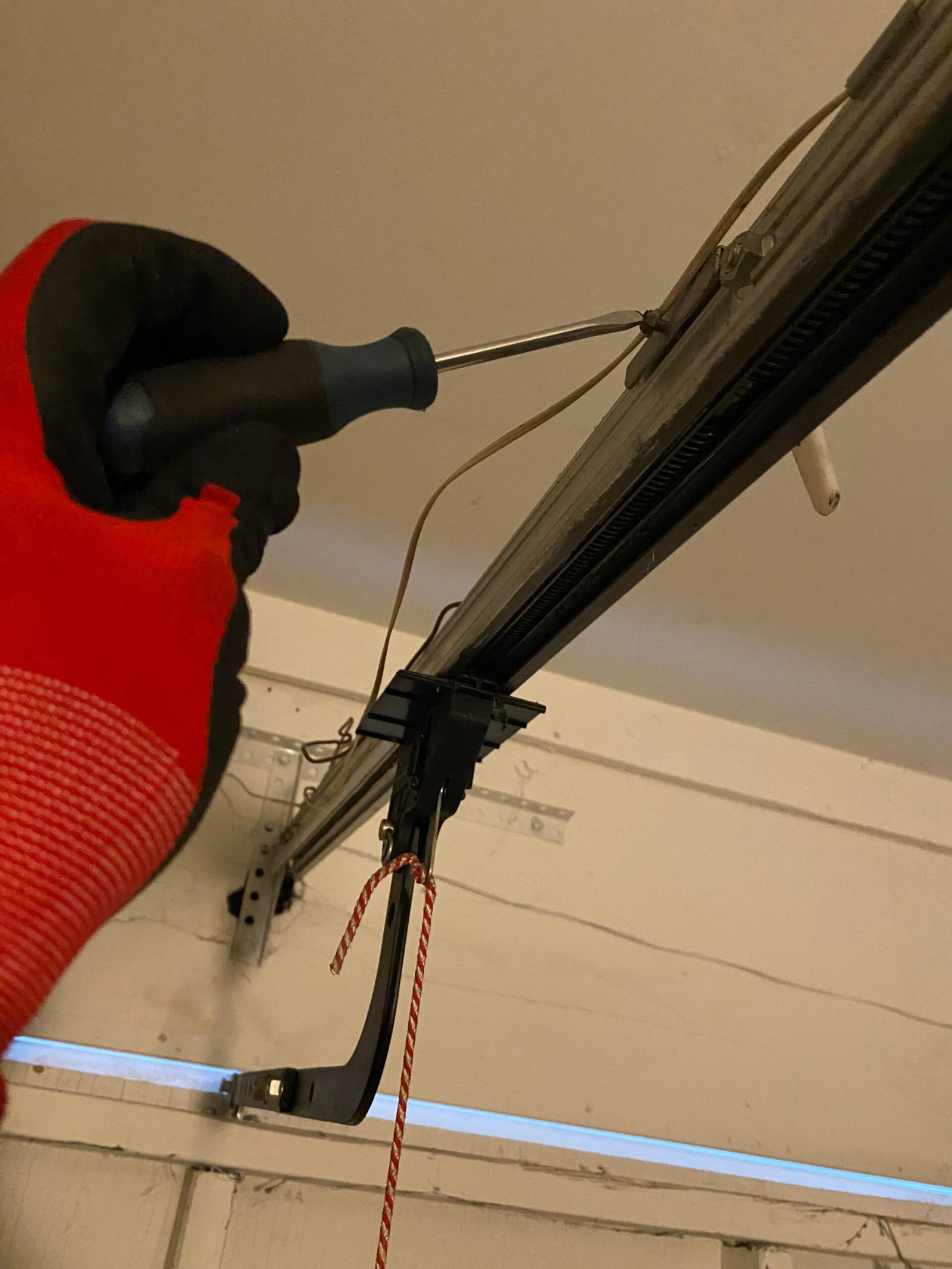 Garage door opener travel limit adjustment during off-track door repair in Old Pasadena CA